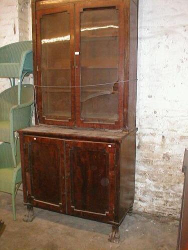 A Regency brass inlaid mahogany cabinet bookcase