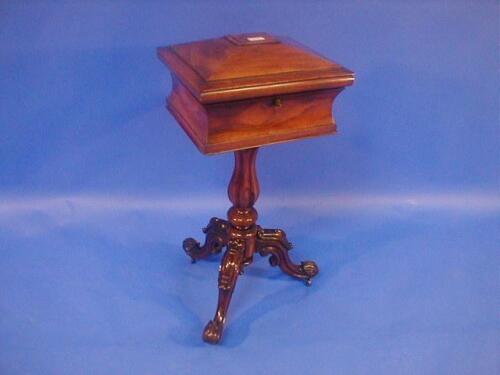 A William IV rosewood teapoy of sarcophagus form having two caddies and jar receptacles