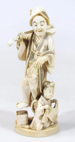 A Japanese late Meiji period ivory figure group