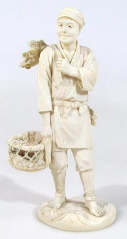 A Japanese Meiji period carved bone figure