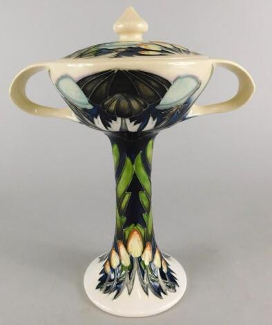 A Moorcroft pottery two handled vase and cover