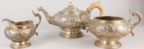 An associated early 19thC silver three piece tea set