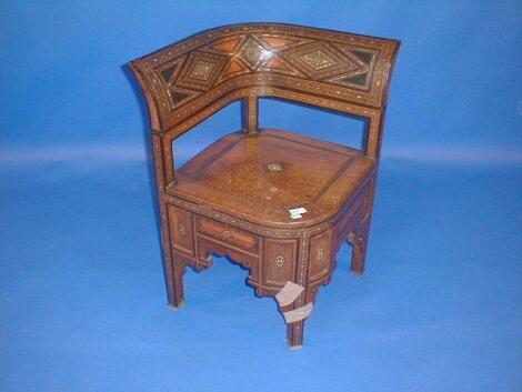 A Moorish padouk corner chair with parquetry inlays of various hardwoods