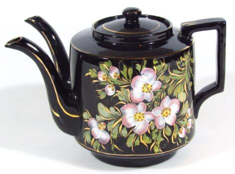 A Victorian pottery double spouted teapot