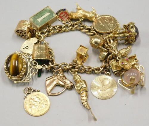 A yellow metal charm bracelet