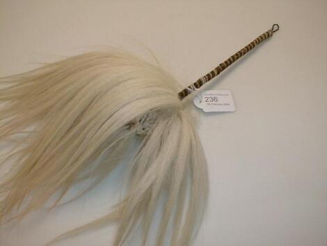 An African fly whisk, the metal handle bound with twine, 16£" high