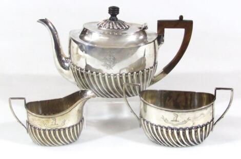 A Victorian harlequin silver three piece tea service