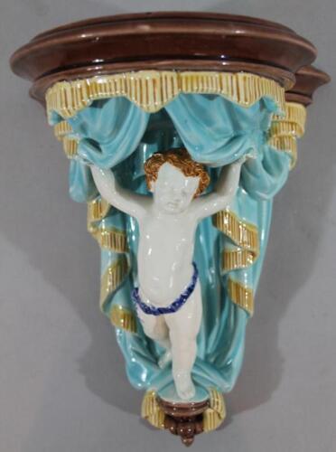 A late 19thC Wedgwood Majolica cherub wall pocket