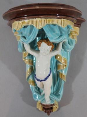 A late 19thC Wedgwood Majolica cherub wall pocket