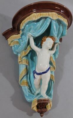 A late 19thC Wedgwood Majolica cherub wall pocket - 2