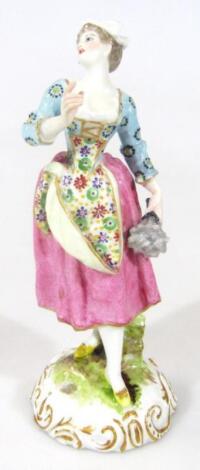 An early 19thC Derby figure of a shepherdess