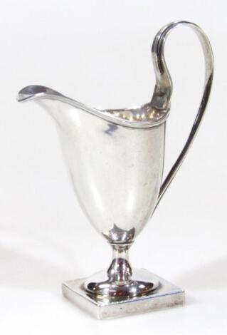 A George V silver helmet shaped cream jug