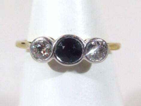 A ladies three stone sapphire and diamond dress ring