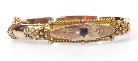 An Edwardian rose gold bangle