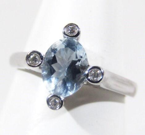 A ladies aquamarine and diamond dress ring