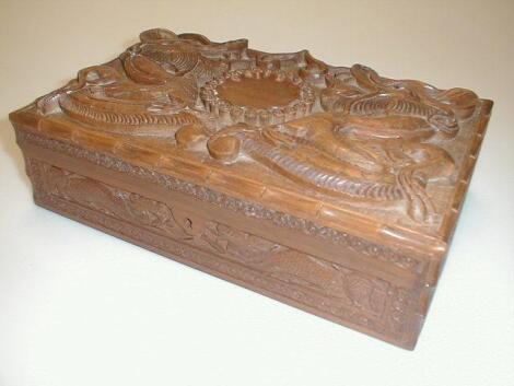 A carved teak box, tin and ashtray