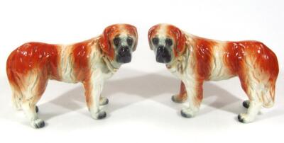 A pair of late 19thC pottery figures of standing St Bernards