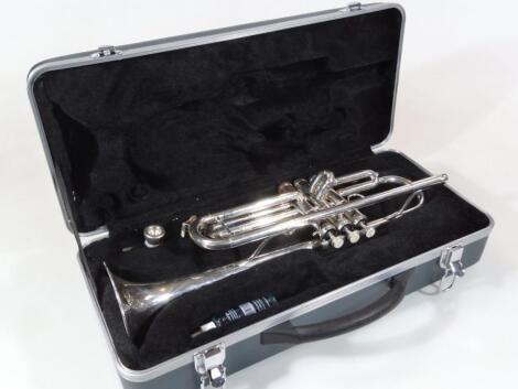 A Berkeley three button chrome coloured trumpet