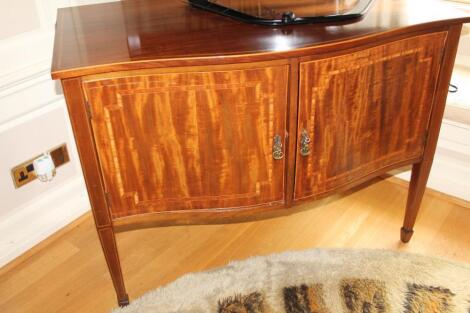 A Sheraton revival bowfront side cabinet