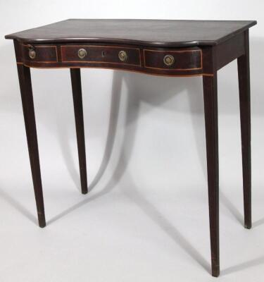 An Edwardian mahogany serving table