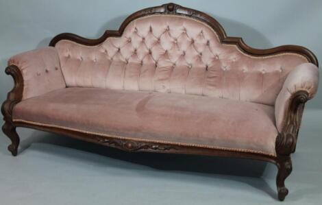 A Victorian mahogany framed scroll arm settee