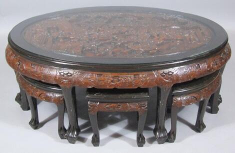 A 20thC Chinese heavily carved table