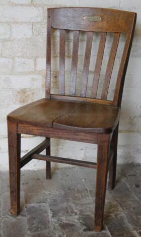 A mid 20thC oak office chair