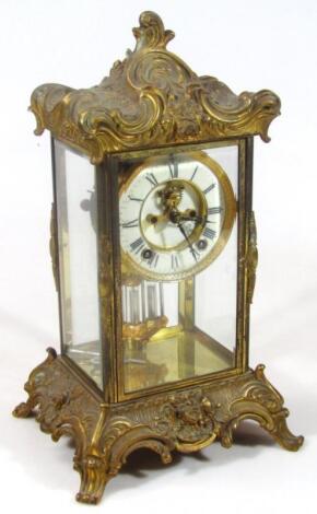 A late 19thC rococo style gilt metal mantel clock