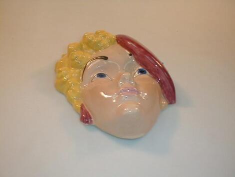 A Beswick wall mask, modelled as a young lady with blond curls, wearing