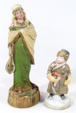 A Russian bisque Pesochnoxe porcelain figure of a boy