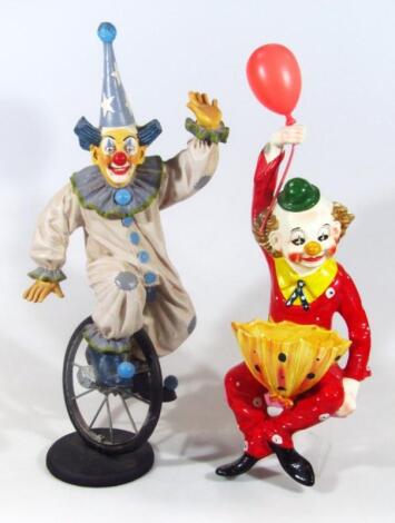 A Jun Asilo resin clown on unicycle figure