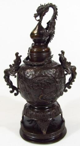 An elaborate Chinese bronze incense jar and cover