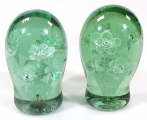 A pair of Victorian green glass dumps