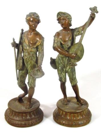 A pair of early 20thC spelter figures of musicians