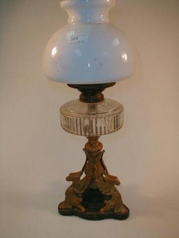 A Victorian cast iron and gilt metal oil lamp