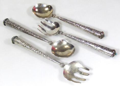 Two pairs of salad servers