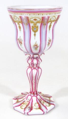 A late 19thC Bohemian milk pink and gilt highlighted glass goblet