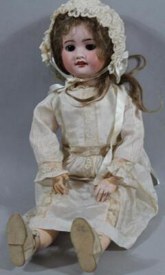 An early 20thC SFBJ porcelain bisque head girl doll