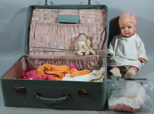 An early 20thC miniature bisque headed child doll