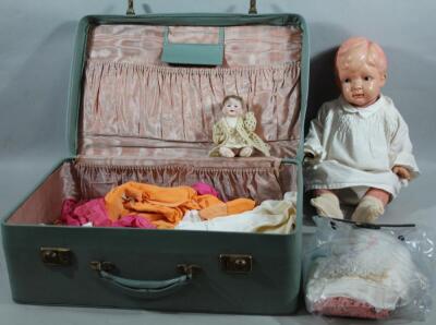 An early 20thC miniature bisque headed child doll