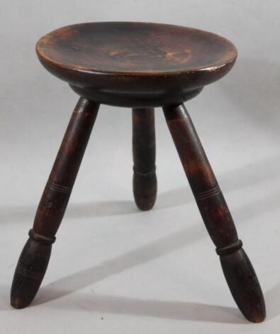 A 19thC stained hardwood and pine three pronged stool