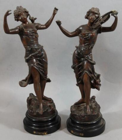 A pair of early 20thC French spelter figure of a dancing girl and musician