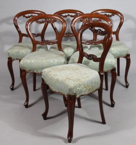 A set of six Victorian mahogany balloon back chairs