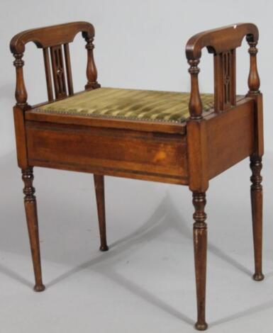 An early Edwardian mahogany piano stool