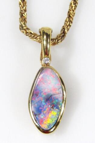 An 18ct gold opal and diamond set pendant