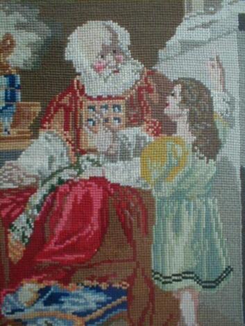 An early 20thC woolwork panel of an elderly man and child