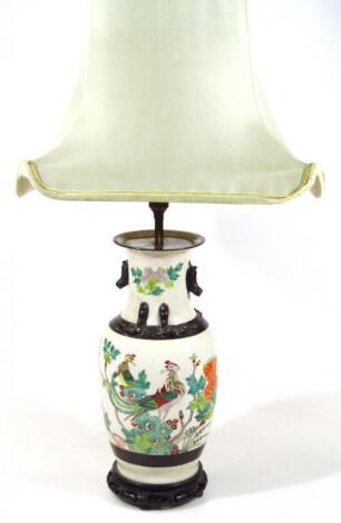 An early 20thC Chinese pottery lamp vase