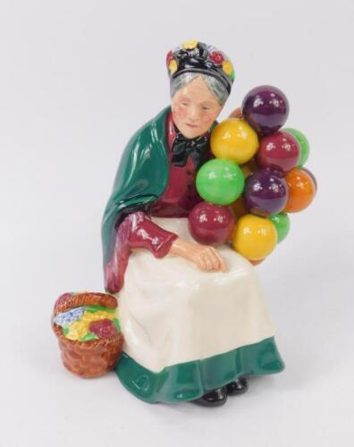 A Royal Doulton figure modelled as The Old Balloon Seller