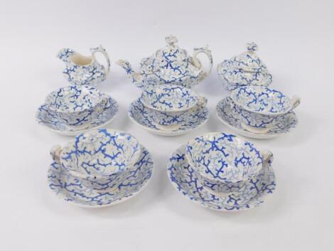 An early 19thC Staffordshire blue and white pottery part child's tea service decorated in a seaweed