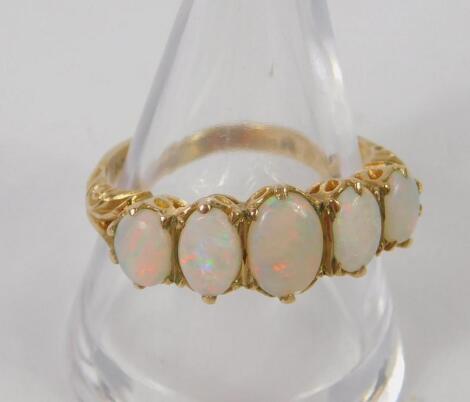 A 9ct gold and opal five stone ring